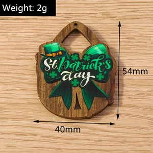 Close-up of wooden shamrock pendant for St. Patrick's Day DIY accessories with size data