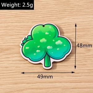Green shamrock charm pendant with dimensions 48mm by 49mm and 2.5g weight detail