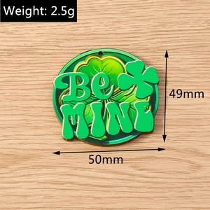 Detail view of 50mm green clover acrylic charm with BE MINE text and size measurement