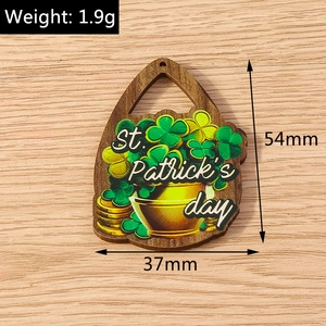 Detail view of a 54mm St. Patrick's Day wooden clover pendant with engraved greetings