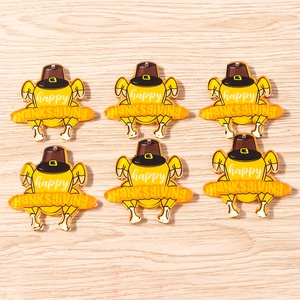Detail of 6 yellow turkey charms with Happy Thanksgiving banner for festive DIY jewelry