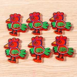 Detail view of 6-piece orange acrylic turkey pendants for DIY necklaces and jewelry making
