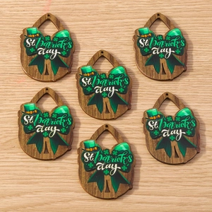 Macro detail of wooden St. Patrick's Day pendants with shamrock and hat designs