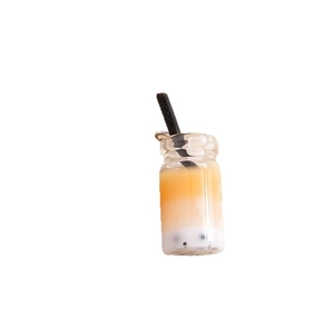 Miniature tricolor bubble tea pendant with resin pearls and metal hook on white background
