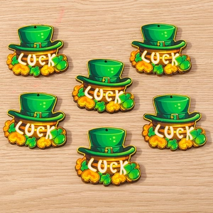 Detailed view of St. Patrick's Day shamrock and luck wooden charms for DIY crafts