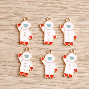 Set of six colorful creative astronaut charms for DIY necklaces and keychains in gold finish