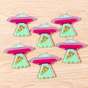Detailed macro view of creative UFO acrylic pendants for DIY jewelry and keychains