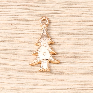 Detailed close-up of rose gold Christmas tree pendants with star relief for DIY jewelry