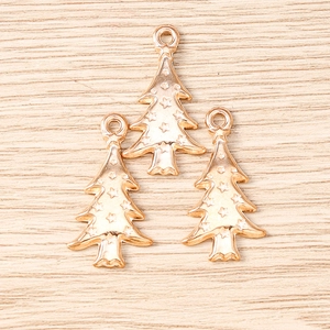 Detailed macro view of three rose gold star-patterned Christmas tree metal charms