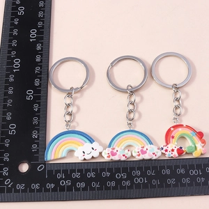 Detail view of colorful rainbow cloud keychains with cute star and heart elements