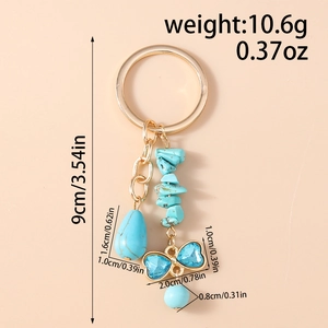 Detailed dimension guide for turquoise turtle keychain with blue bow and stone charm
