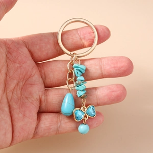 Ethnic style hollow turtle keychain with turquoise stones and blue crystal butterfly pendant