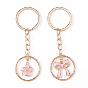 Pink enamel flower and bow gold keychain charms set with circular ring for bags