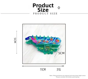 Détails des dimensions de la pince à cheveux paon mesurant 11 cm de long et 5 cm de haut