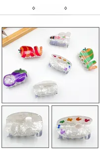 Detailed close-up showing the artistic palette acetate hair claw clip with pearlescent texture