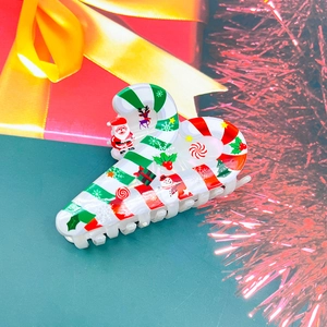 Pince à cheveux avec motifs de renne et bonhomme de neige sur une boîte cadeau de Noël