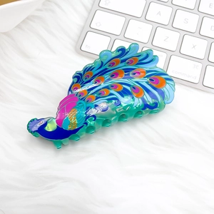 Pince à cheveux paon colorée classique en résine brillante avec détails à paillettes
