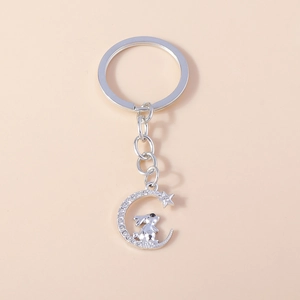 Detailed view of silver moon and rabbit keychain with sparkling white rhinestones