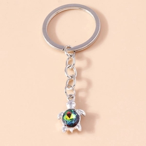Silver turtle keychain featuring a colorful faceted rhinestone shell and polished metal link