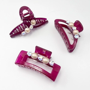 Three-piece red rhinestone and pearl hair claw clip set with elegant resin finish