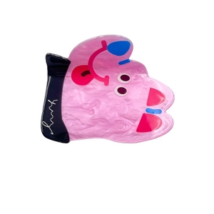 Pink marble acrylic dog hair claw clip with cute cartoon features and Chunks logo