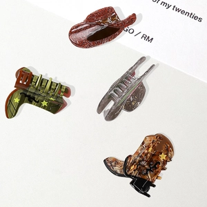 Retro acetate hair claw clips in western cowboy hat and boot shapes with marble patterns