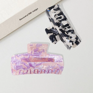 Elegant large acetic acid hair claws in ink marble and pink marble patterns
