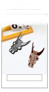 Detail view of large skull-shaped hair claw clips with marble texture and big clip design
