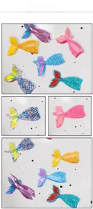 Detail showing various colorful acetate mermaid tail hair claws with scale texture