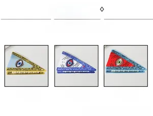Detailed comparison of three Evil Eye triangle hair claws in multiple vibrant colors