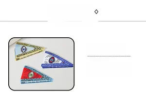 Macro detail of triangle Evil Eye hair claws in blue, red and yellow color options