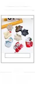 Detailed set of Christmas acrylic hair claws featuring snowman and snowflake designs