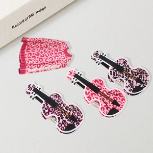 Leopard print guitar-shaped hair claw clips set in pink, purple, and black acrylic finish