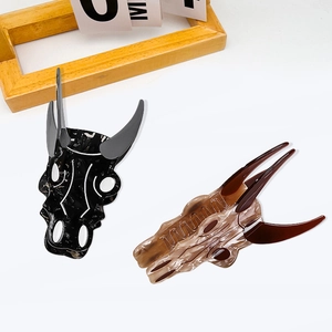 Chic bull skull hair claws in glossy black and amber marble finish for thick hair