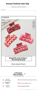 Detail view of square hair claw clips with heart patterns in various color designs
