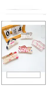 Flat lay of five large acrylic hair claws with cute animal prints like dalmatian and bear