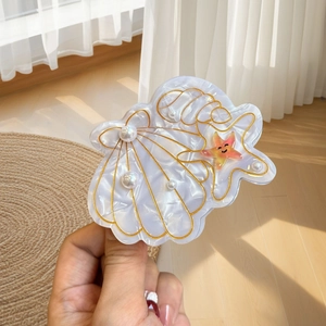 Pince à cheveux chic en acétate avec motif de coquillage nacré et étoile de mer