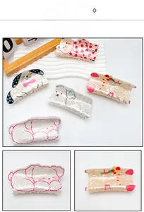 Close-up of cute acrylic animal hair claws with pearlescent texture and floral cat designs