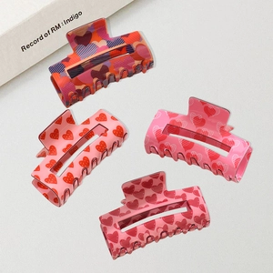 Set of four square hair claw clips with colorful heart patterns for elegant hair styling
