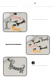 Detail showing various dachshund hair clips in leopard and acetate patterns with rhinestones