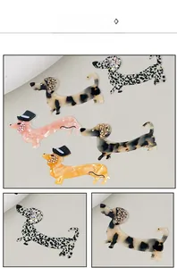 Macro shot of dachshund hair clips with leopard print, acetate finish, and rhinestone details