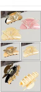 Vues détaillées des pinces à cheveux papillon évidées avec cristaux et strass brillants