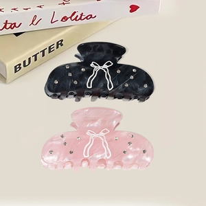 Pince à cheveux moyenne en acétate avec motif nœud, marbrure et strass brillants