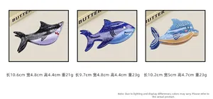 Detail view of acetate dolphin and shark hair claws with specific sizes and weights