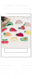Detailed view of ten colorful acrylic fruit hair claws featuring strawberry and watermelon designs