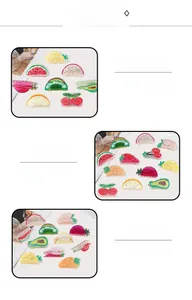Macro shot of colorful acrylic fruit-shaped hair claws featuring hand-painted details