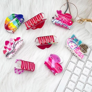 Colorful acrylic hair claw clips with red lips and love heart designs for Valentine's Day