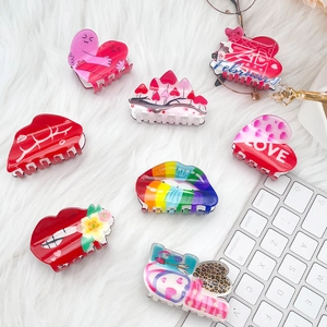 Colorful acrylic heart and red lip hair claw set with LOVE patterns on white fur