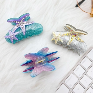 Pinces à cheveux étoile de mer étincelantes avec strass et paillettes bleues et mauves