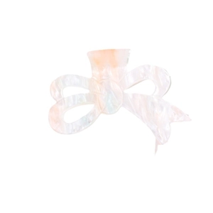 Elegant French-style bow hair claw clip in pearlescent white and soft orange tones